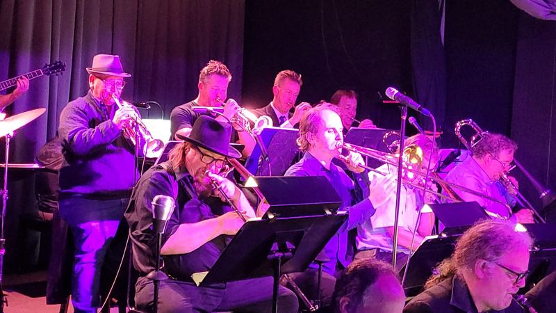 A Bay Area jazz big band performing for a crowd